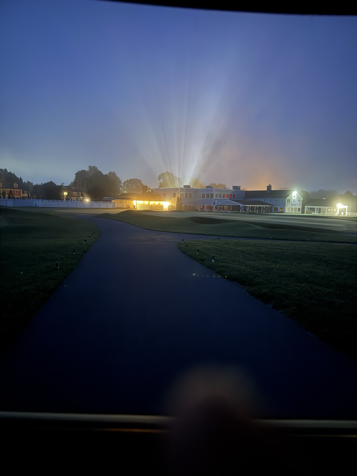 Golf course and clubhouse illuminated at night