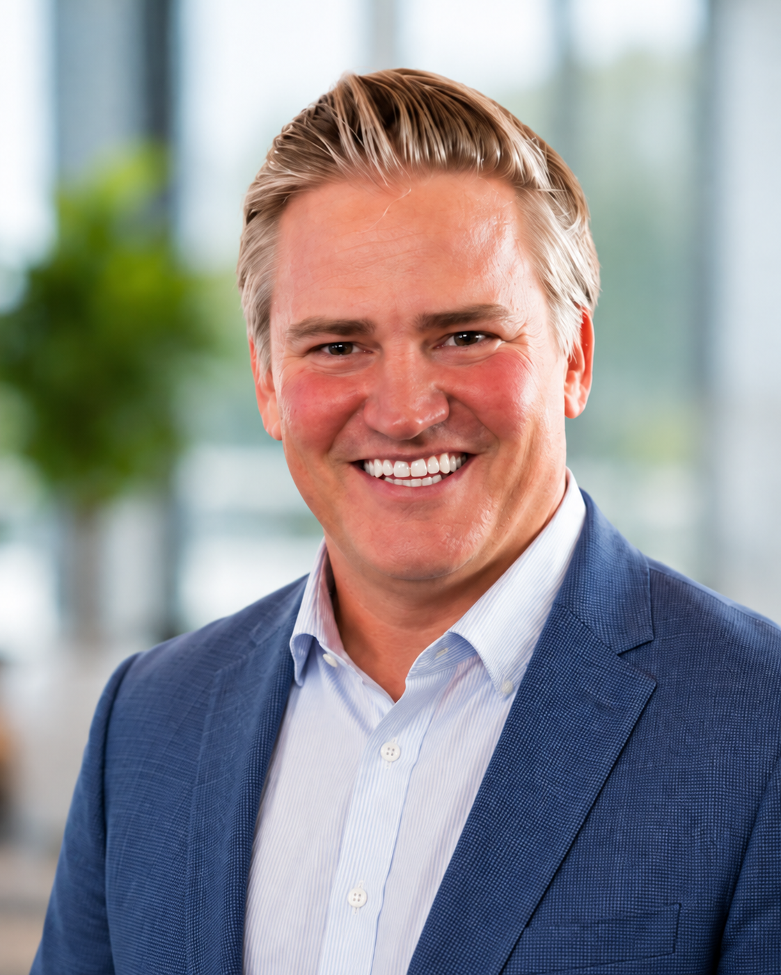 Professional headshot of Tommy Bryan, founder of CaddyJet